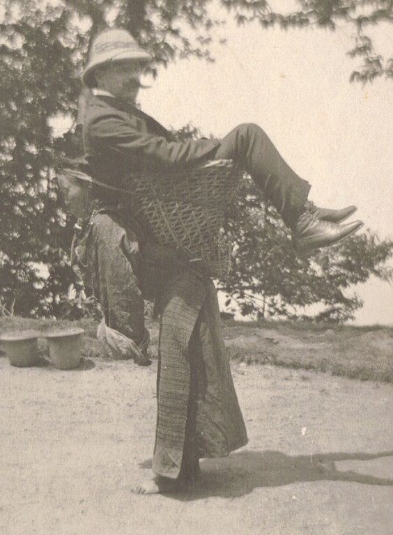 15 A Sikkimese woman carrying a European man on her back West Bengal India c. 1900..jpg