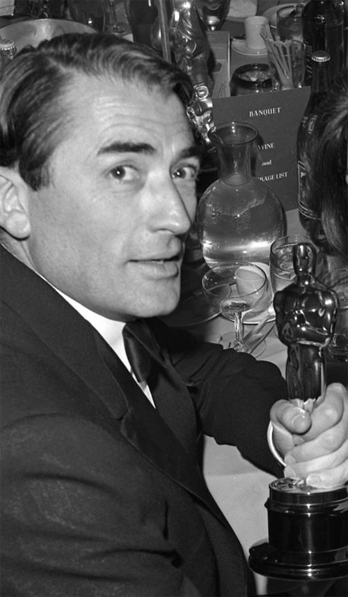 31 with his 1962 Oscar for Best Actor for his role as Atticus Finch in To Kill a Mockingbird.jpg